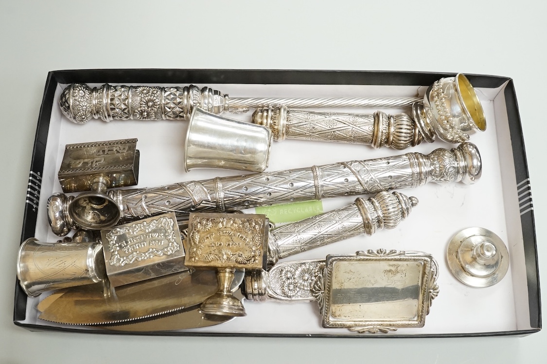 A small group of assorted continental 925 and other white metal items including a Judaic scroll holder, a Torah pointer?(lacking pointer), an Israeli ashtray, three Judaic match sleeves, two 925 handled servers and an Ir